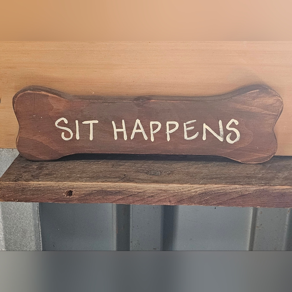 Wooden Sign with 'Sit Happens' Text